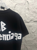 Black Balenciaga T-shirt with partial BALENCIACA logo and AB symbol print