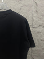 Balenciaga dark T-shirt side view with crew neck and short sleeve