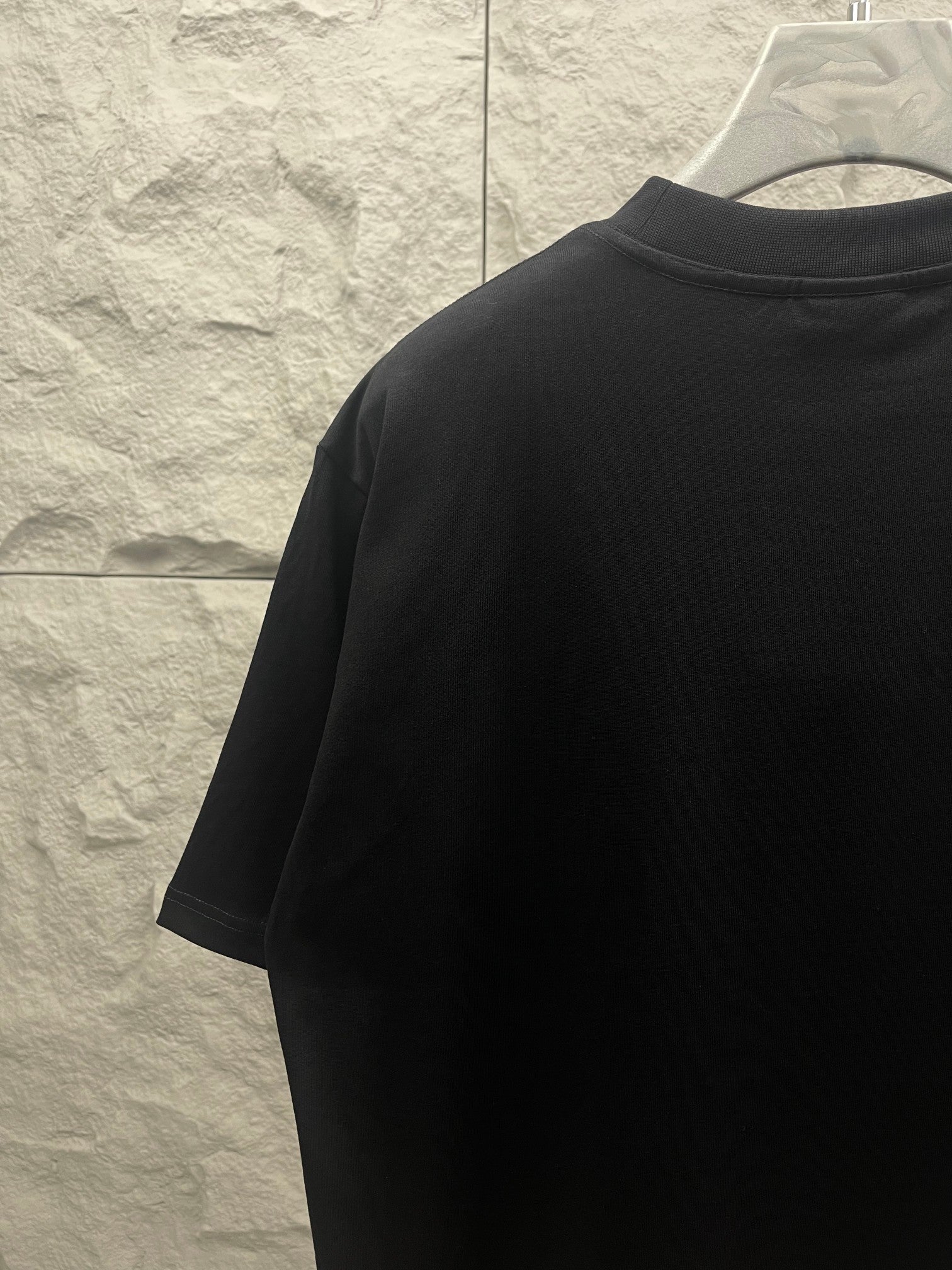 Balenciaga dark T-shirt back side view with short sleeves and crew neck