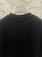 Balenciaga dark T-shirt back view with high collar and clean panel