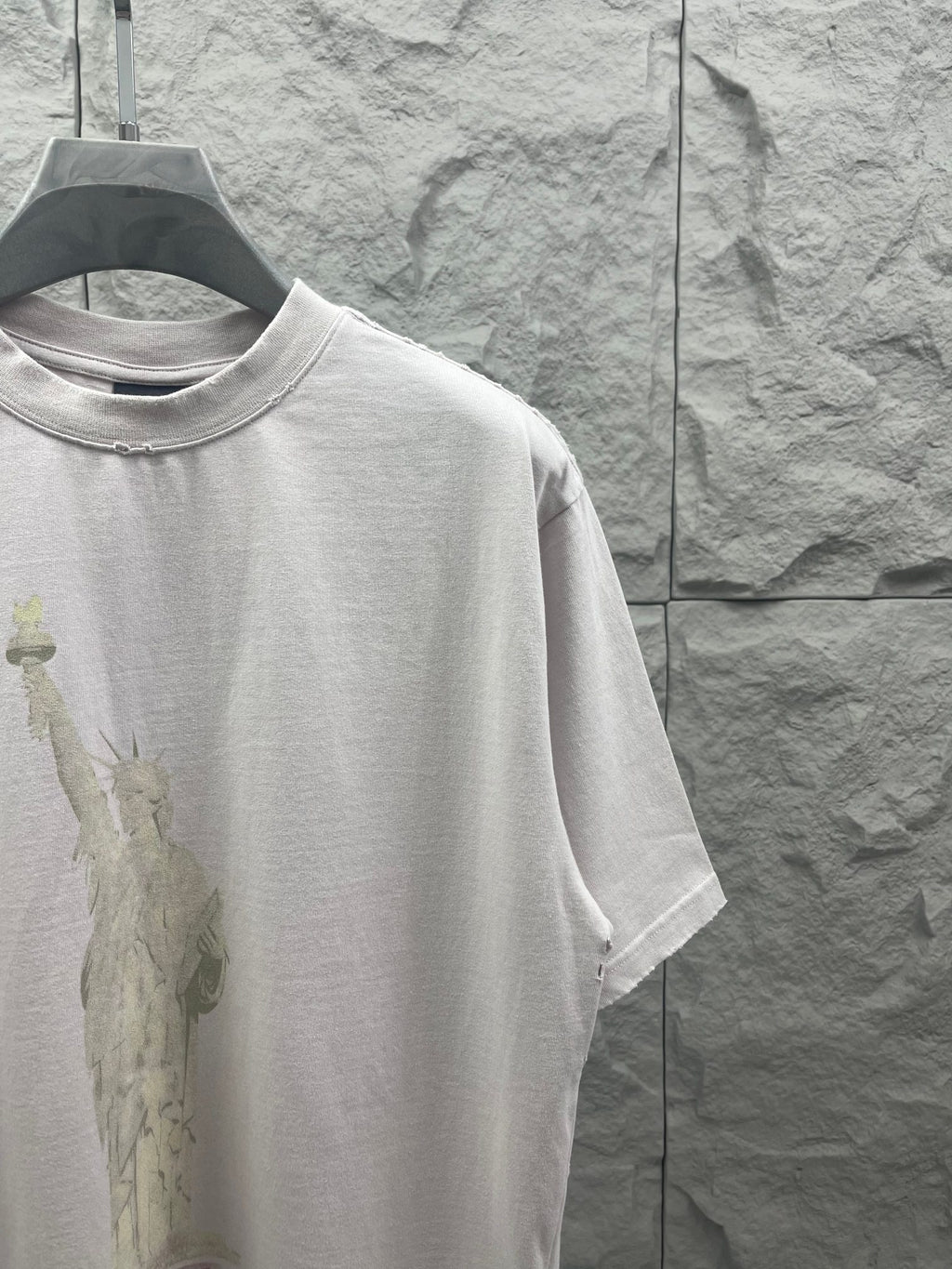 Balenciaga white T-shirt side view with Statue of Liberty graphic on front