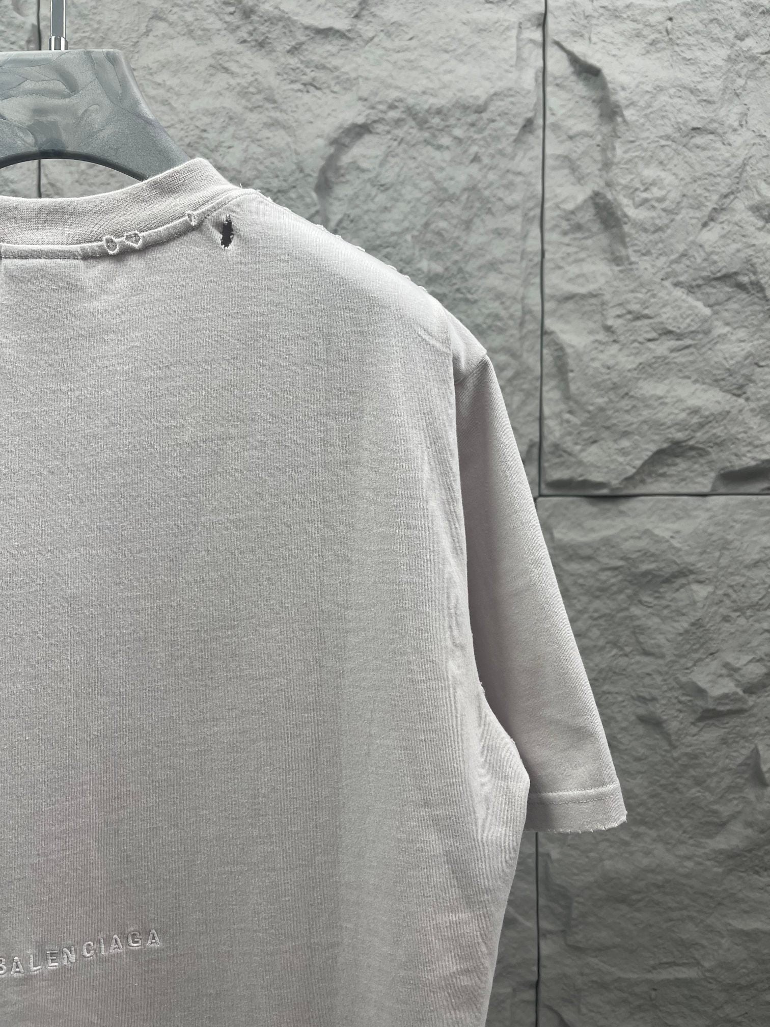 Balenciaga white T-shirt back view with collar detail and partial logo