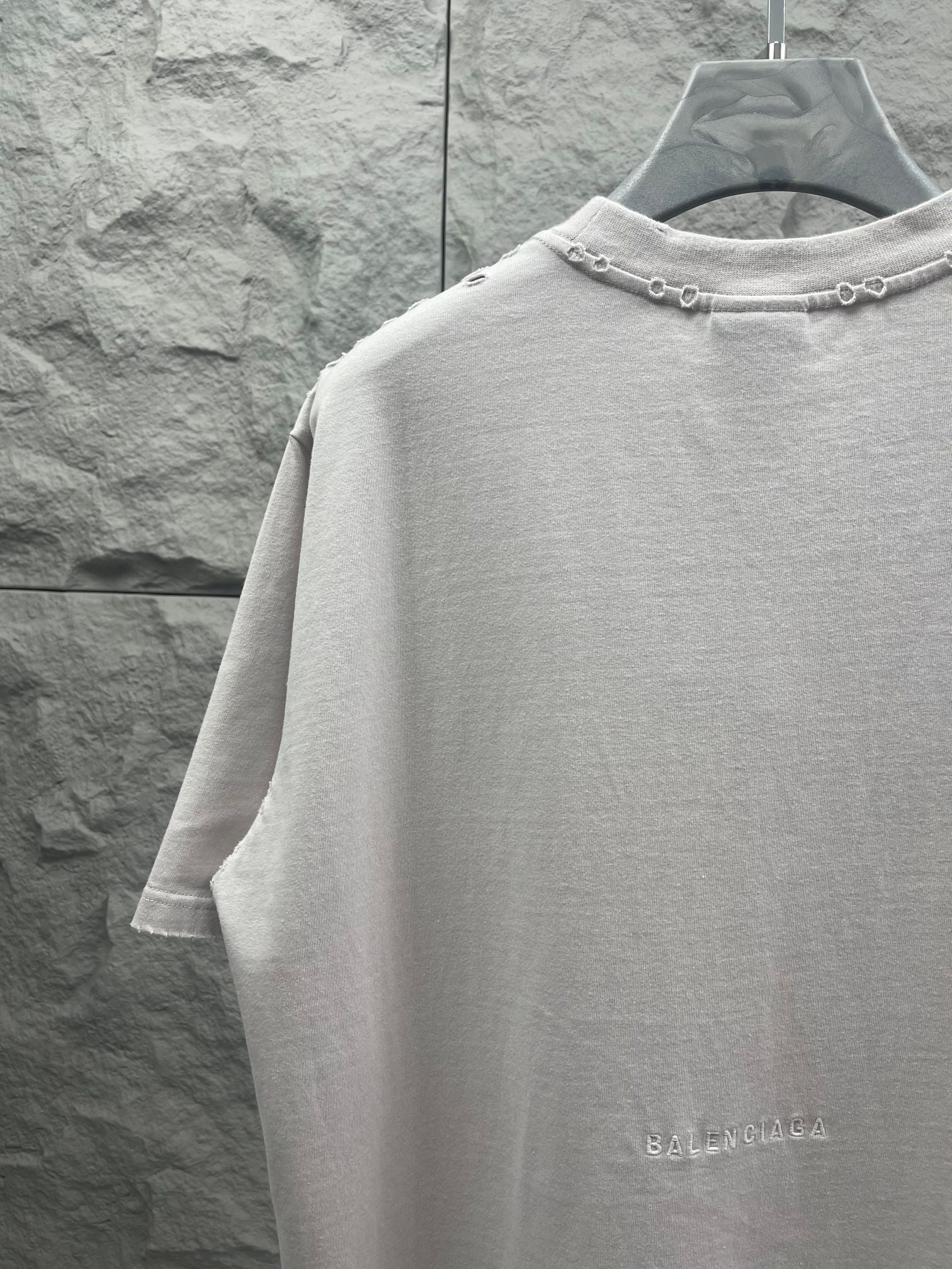 Balenciaga white T-shirt back view with chain detail at collar and BALENCIAGA print