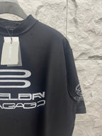 Balenciaga dark short-sleeve T-shirt with sleeve graphic and hanging tag