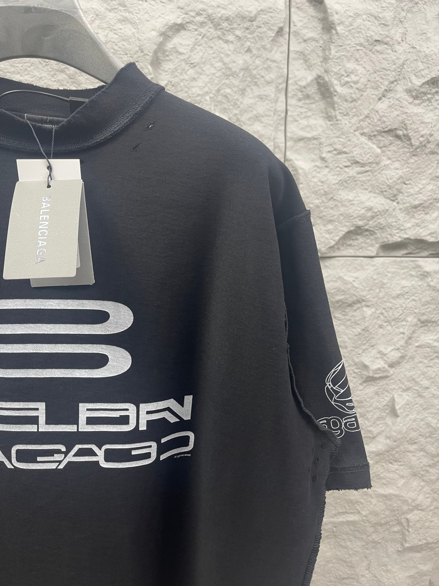 Balenciaga dark short-sleeve T-shirt with sleeve graphic and hanging tag