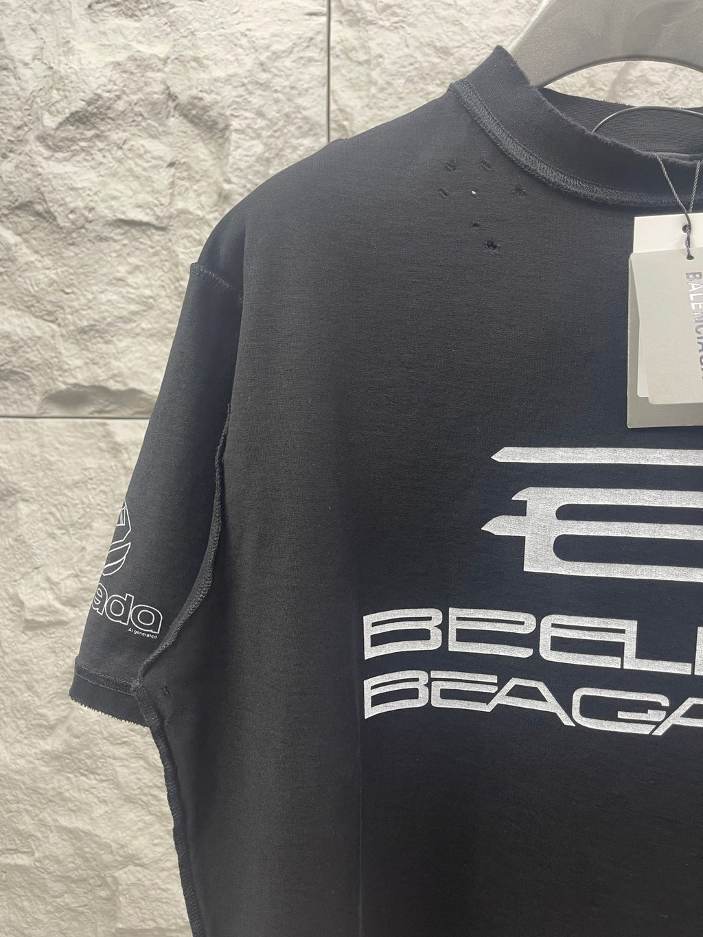 Balenciaga dark short-sleeve T-shirt with partial chest logo and sleeve print