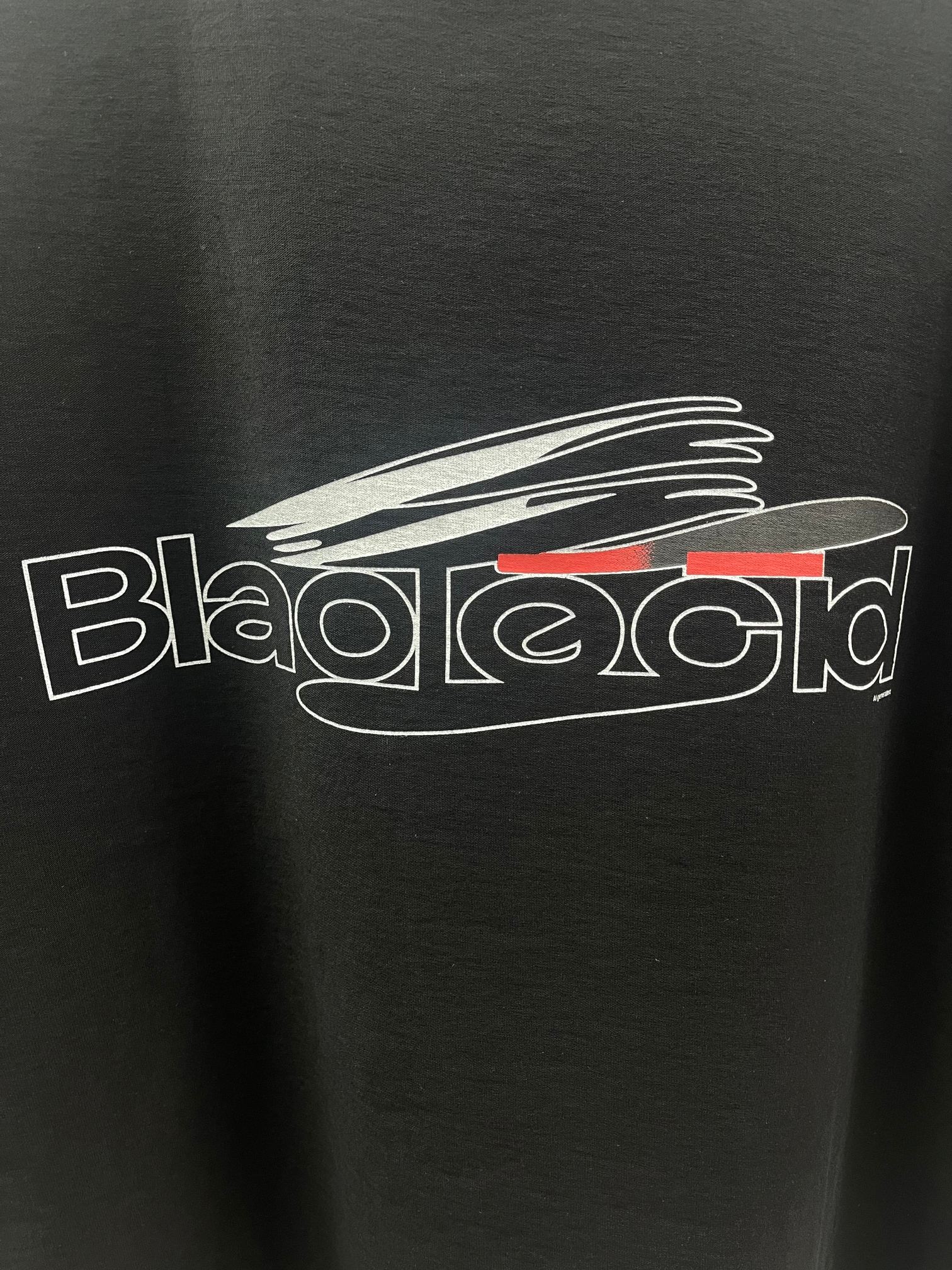 Balenciaga dark short-sleeve T-shirt with close-up chest graphic logo