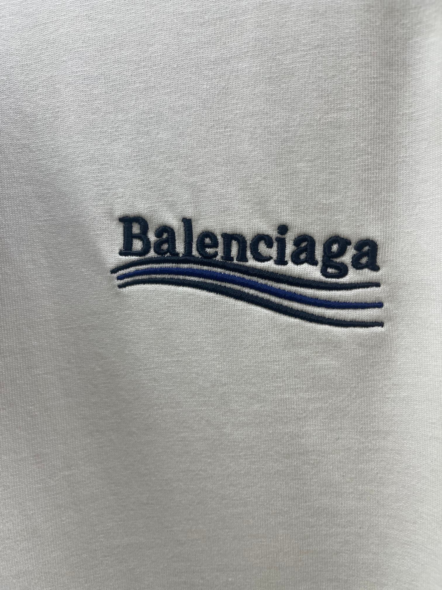 Balenciaga logo text with blue stripe graphic on off-white T-shirt