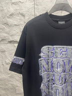 Balenciaga graphic T-shirt in dark color with large blue-toned logo print front