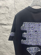 Balenciaga graphic T-shirt in dark color with blue glitter-style logo print and hourglass