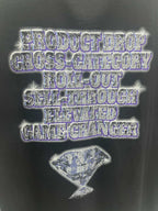 Balenciaga graphic T-shirt close-up: blue-toned logo text and hourglass motif front