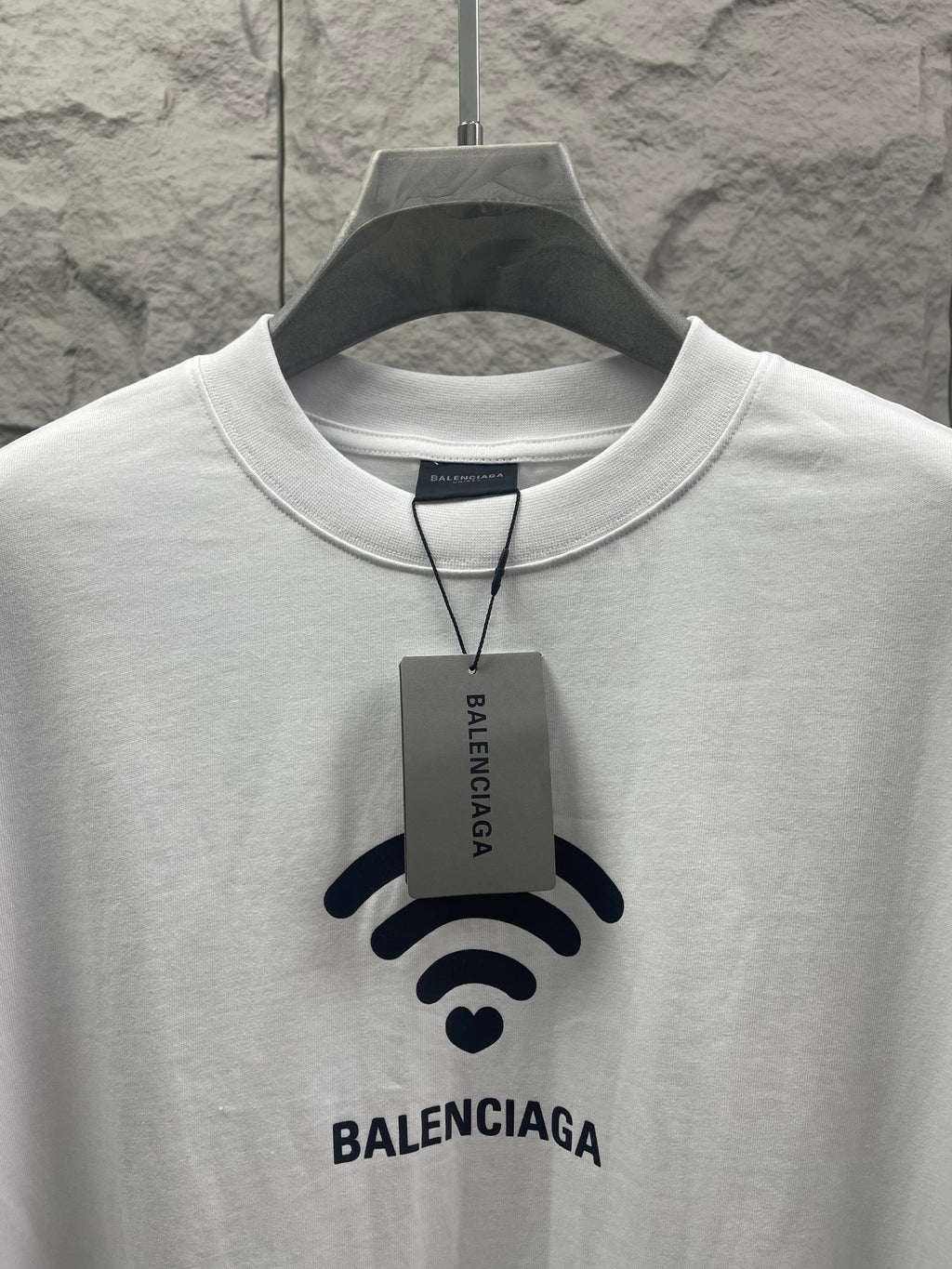 White Balenciaga crew-neck T-shirt with Wi‑Fi logo, attached brand tag