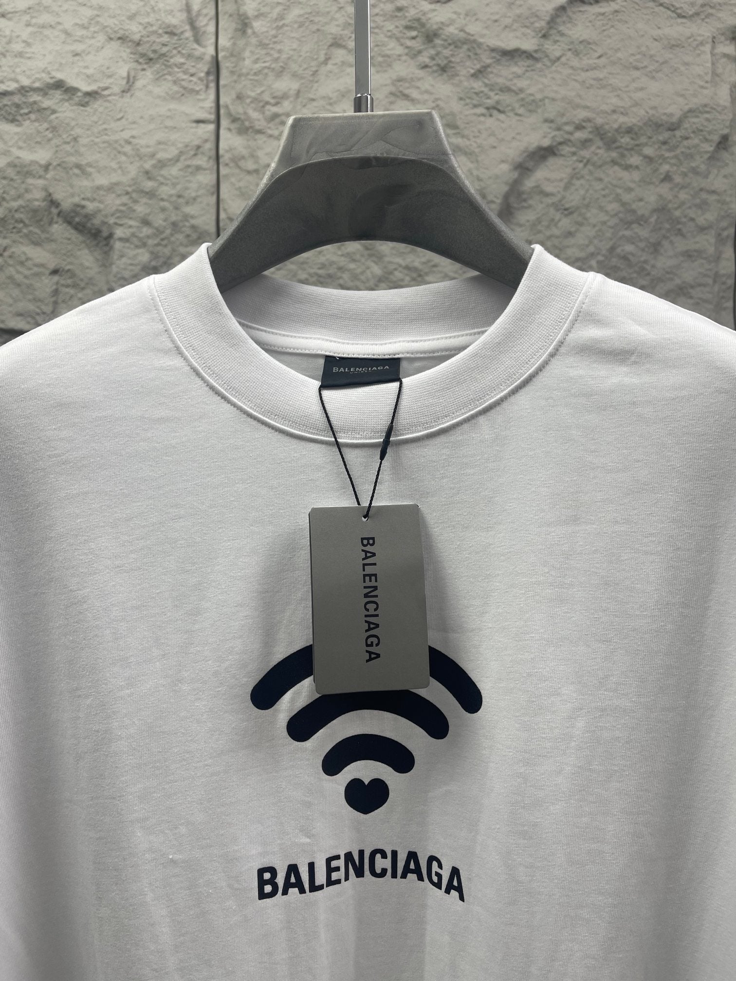 White Balenciaga crew-neck T-shirt with Wi‑Fi logo, attached brand tag