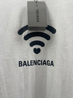 White Balenciaga T-shirt front with Wi‑Fi logo and hanging size tag