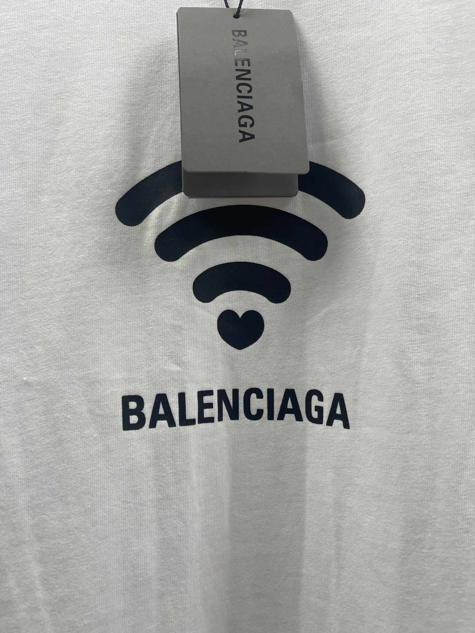 White Balenciaga T-shirt front with Wi‑Fi logo and hanging size tag