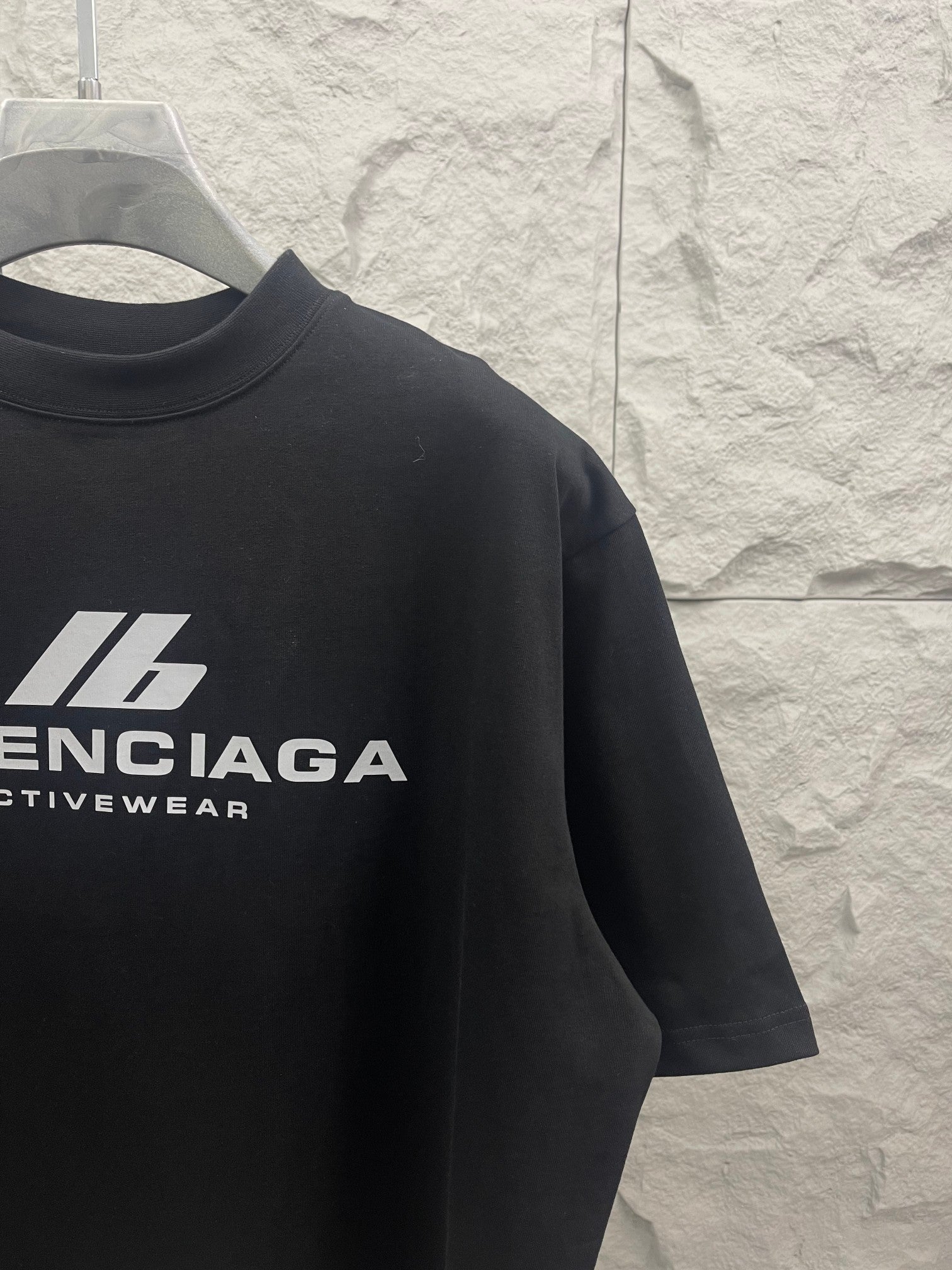 Black Balenciaga Activewear T-shirt sleeve with partial logo graphic