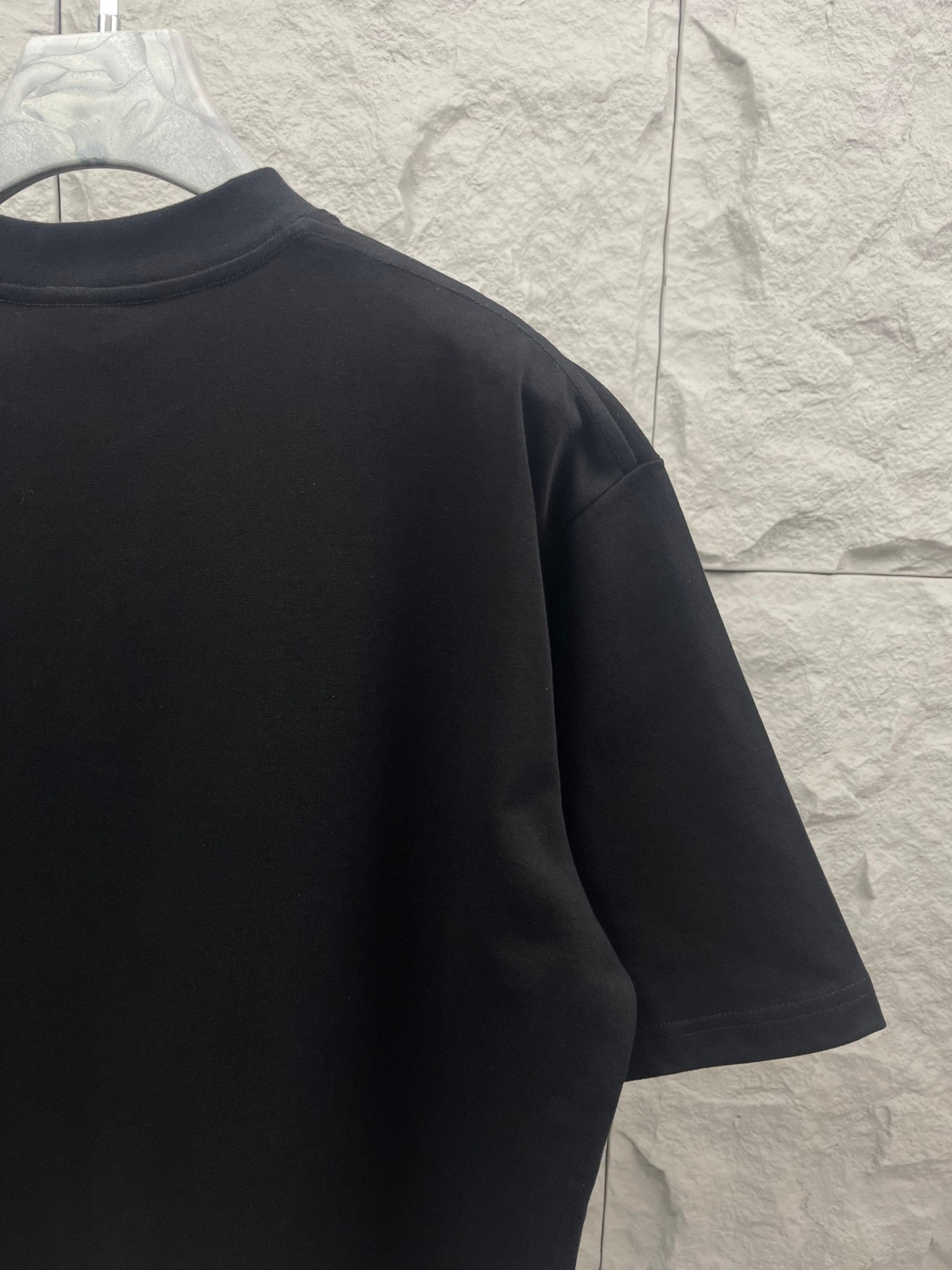 Black Balenciaga Activewear T-shirt side/back view, short sleeves and crew neck