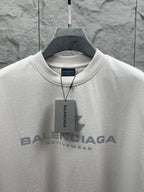 Balenciaga short-sleeve T-shirt, white, crew neck with logo and tag.