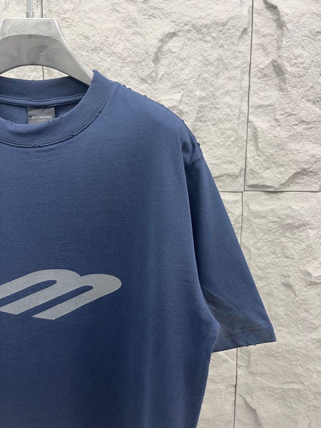Balenciaga short-sleeve T-shirt, blue, close-up of front logo graphic