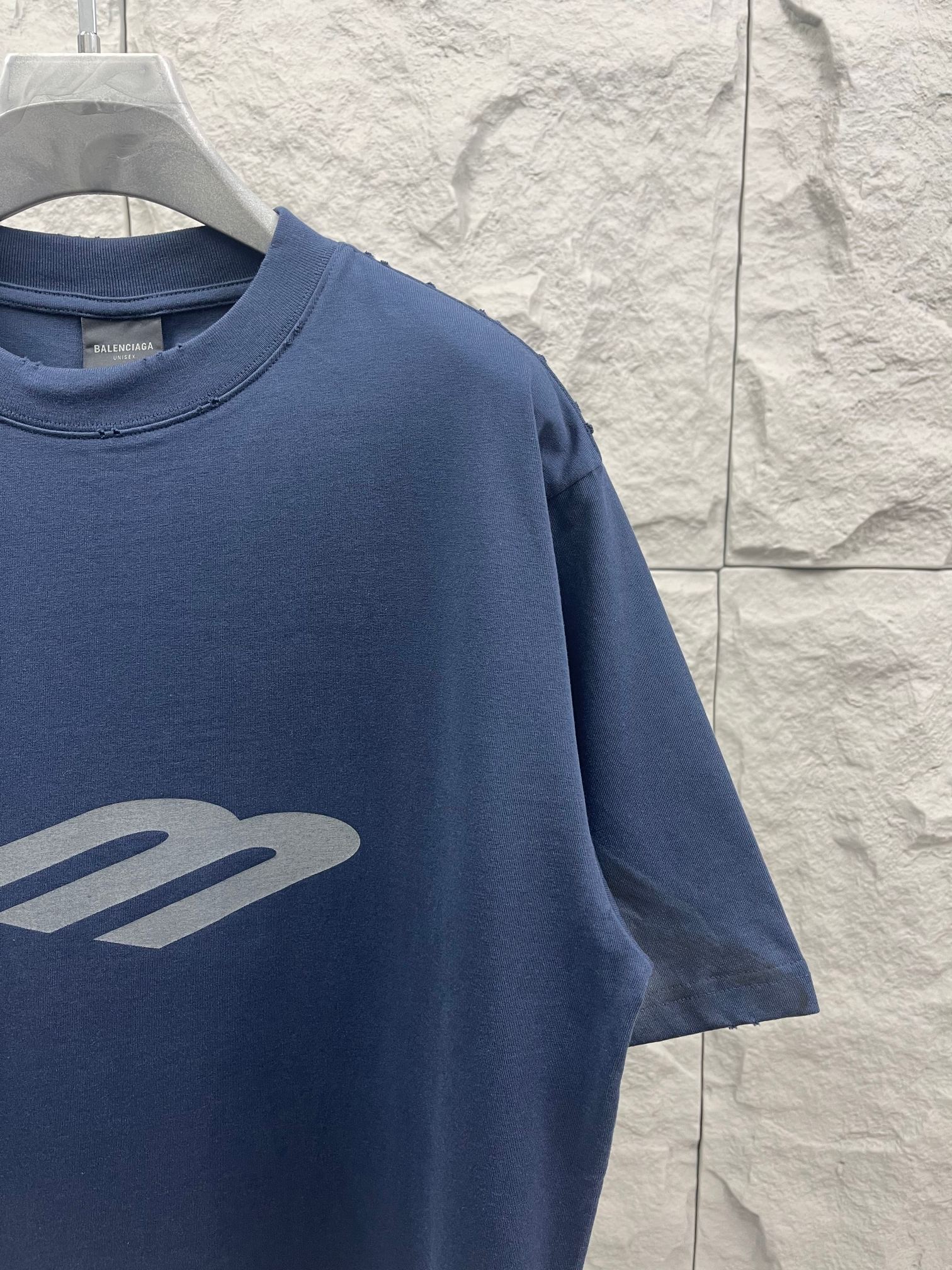 Balenciaga short-sleeve T-shirt, blue, close-up of front logo graphic