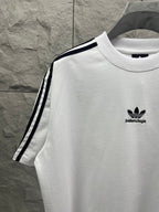 Balenciaga white short-sleeve T-shirt with small chest logo and black side stripe