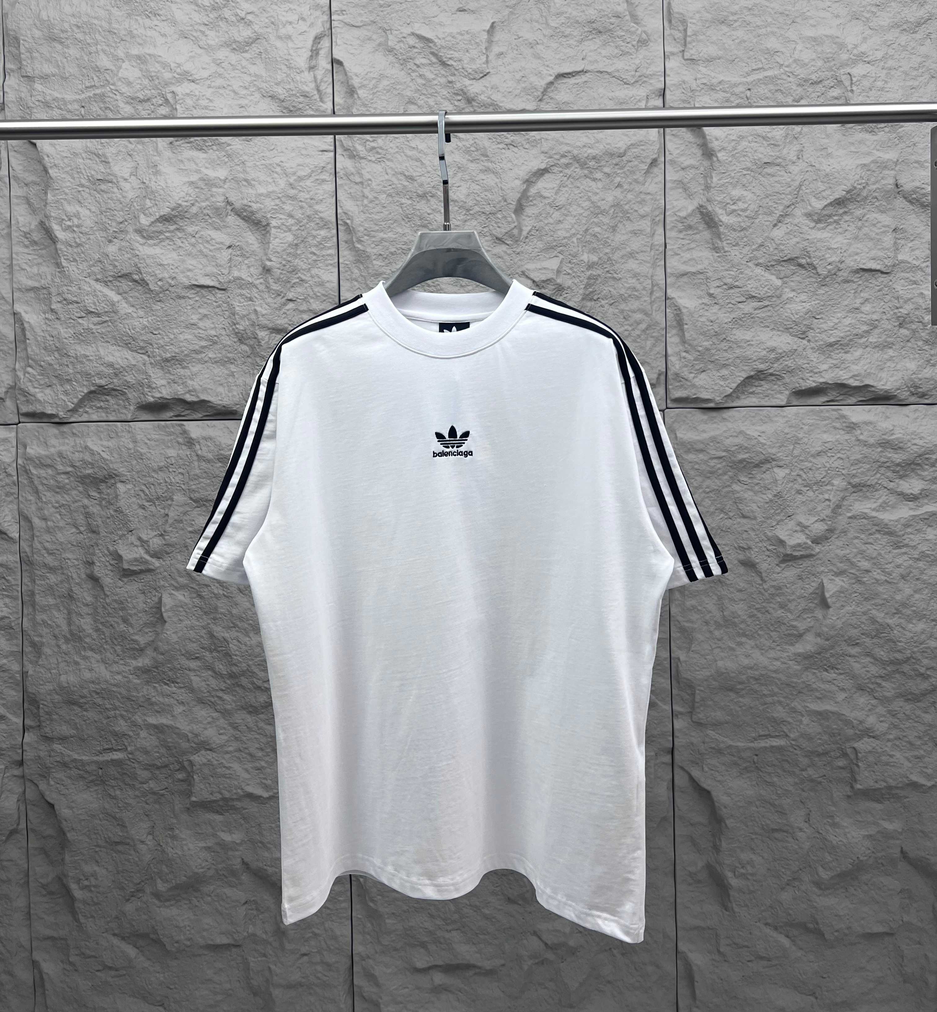 Balenciaga white short-sleeve T-shirt with black triple-stripe sleeves and chest logo
