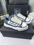 Blue and white low-top sneakers with white laces and chunky white rubber sole
