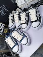 Amiri high-top sneakers with white laces and black plus blue panels