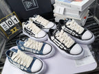 Amiri sneakers with white laces and patterned black or blue canvas uppers