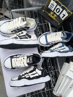 Amiri sneakers with white laces, black-and-cream and navy uppers