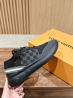 Black mesh lace-up sneakers with white side stripe and cushioned rubber sole.