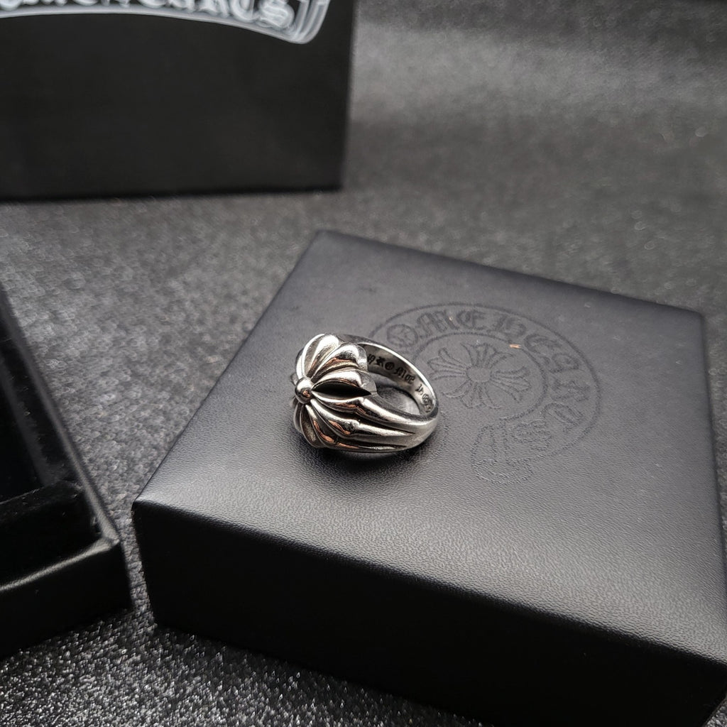 Silver-tone crossover ring with floral center detail
