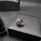 Silver-tone crossover ring with floral center detail