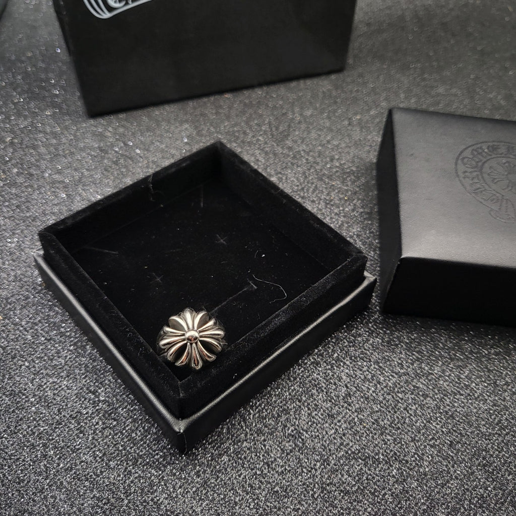 Silver-tone flower design ring in open black box