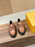 Brown leather lace-up shoes with black rubber sole, round toe, double-row stitching