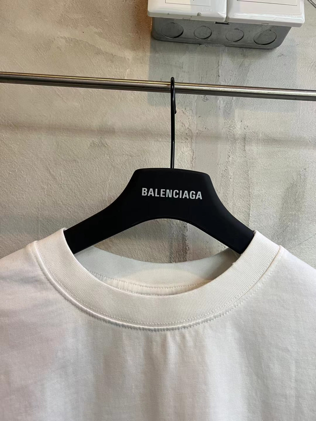 White crew-neck T-shirt with BALENCIAGA neck label