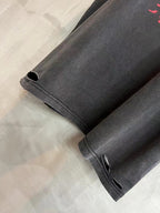 Balenciaga T-shirt sleeve hem in dark gray knit, small distressed openings