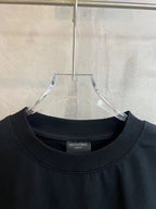 Black crew-neck T-shirt with BALENCIAGA neck label and minimal front panel