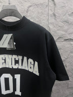 Balenciaga T-shirt in dark navy with “BALENCIAGA 01” logo and size tag