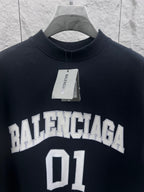 Balenciaga T-shirt in dark navy with centered “BALENCIAGA” and “01” front print