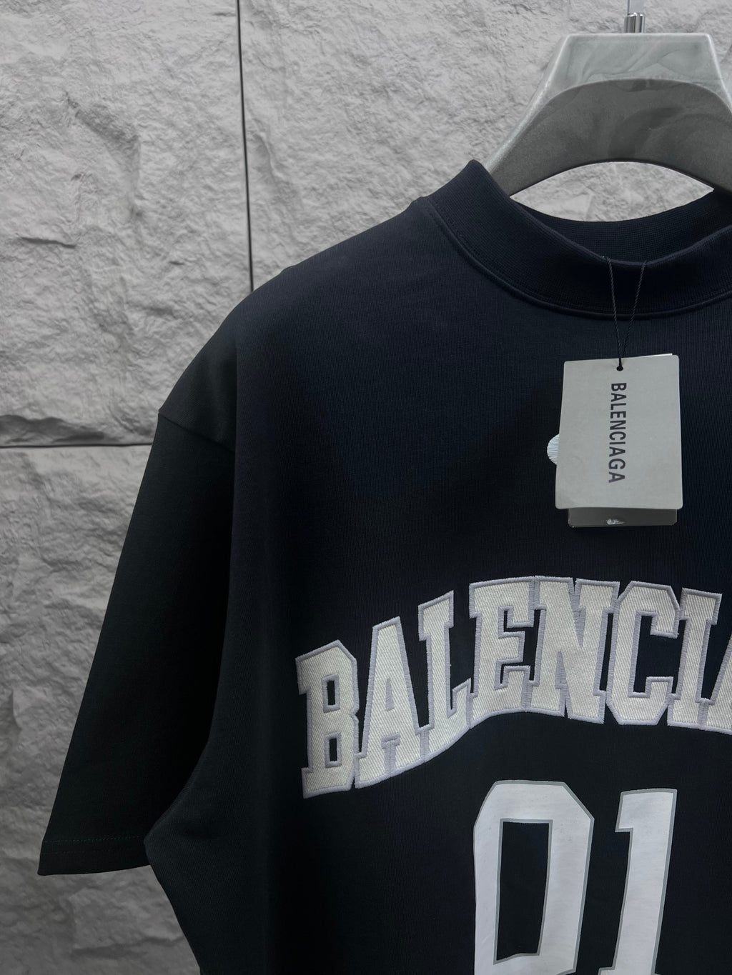 Balenciaga T-shirt in dark navy with neck label and “BALENCIAGA 01” chest graphic