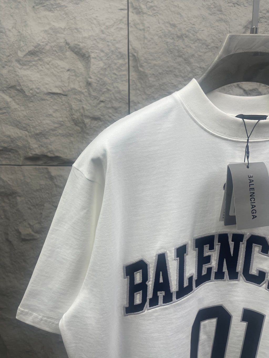 Short-sleeve T-shirt, white; partial 'BALENCIAGA' chest lettering and '01' graphic