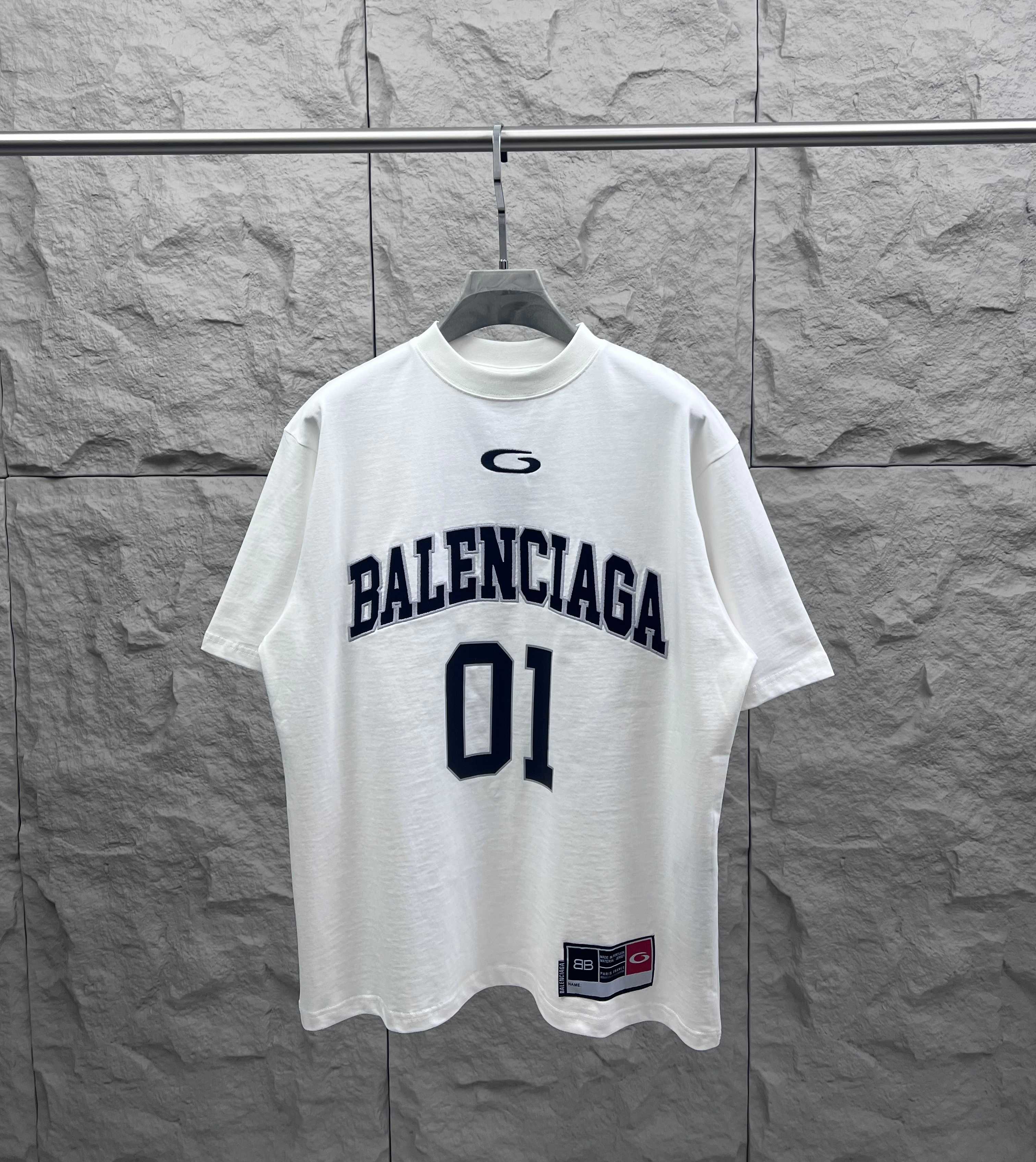White Balenciaga short-sleeve T-shirt with navy “BALENCIAGA” and “01” graphic front