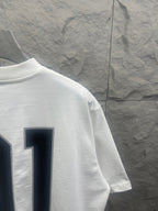 Short-sleeve T-shirt, white; sleeve view with navy outlined '01' print
