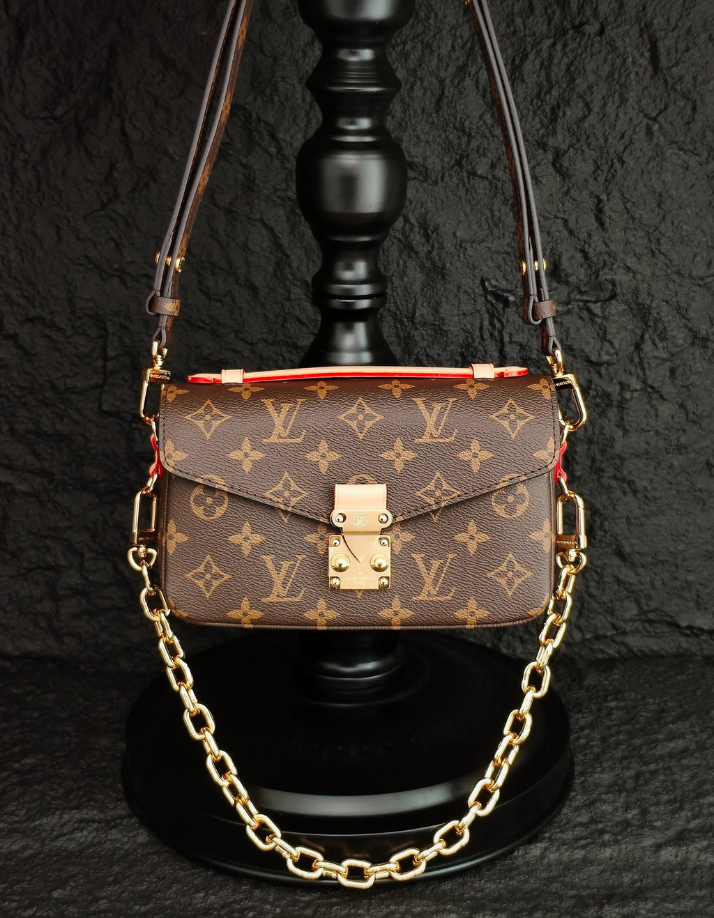 Brown monogram crossbody bag with front flap and gold-tone chain strap