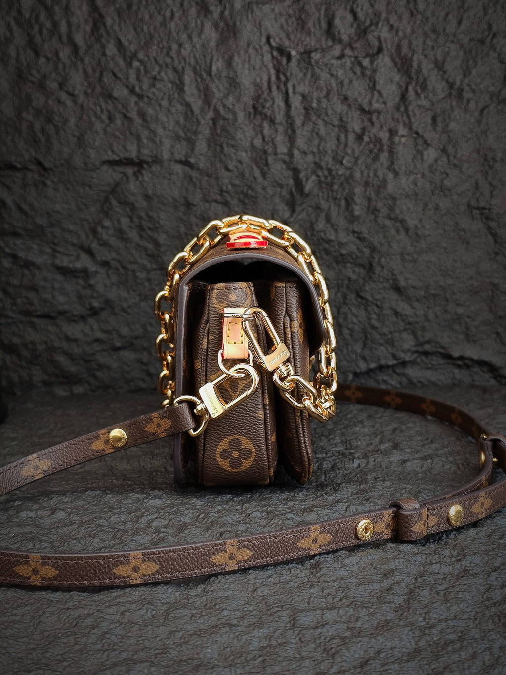Brown monogram mini bag with gold-tone hardware and crossbody strap