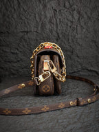 Brown monogram mini bag with gold-tone hardware and crossbody strap