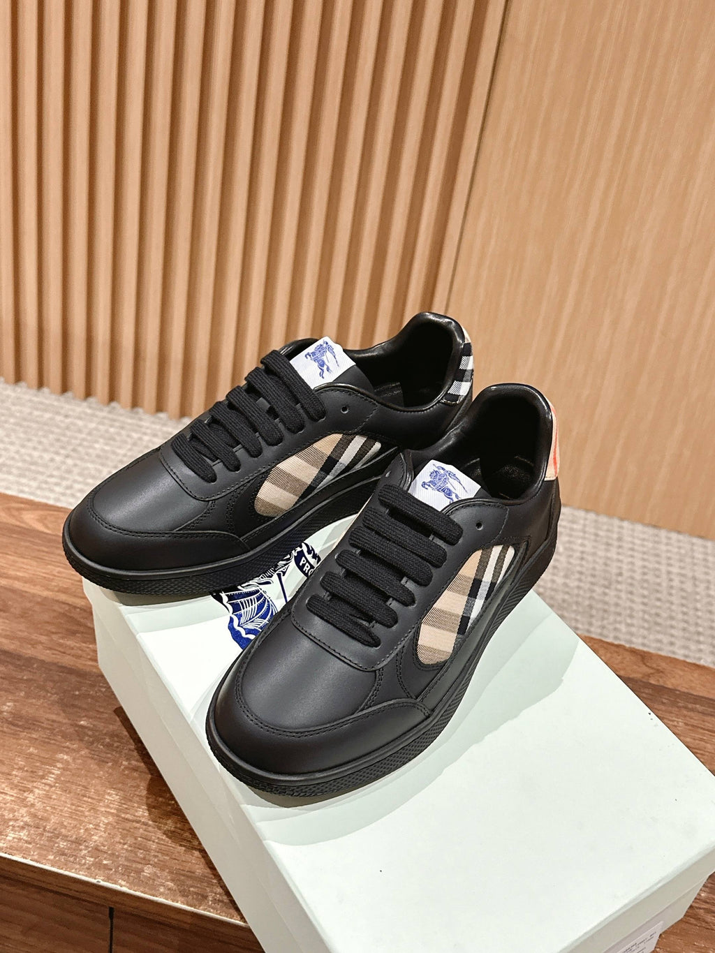 Burberry black leather low-top sneakers with check stripe detail