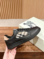 Burberry black low-top sneakers with check panel and textured rubber sole