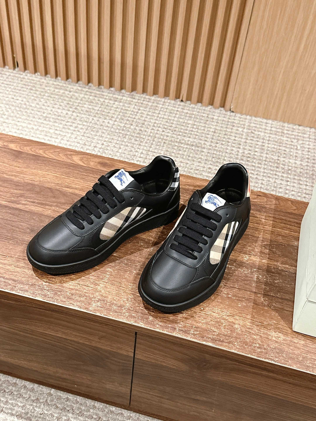 Burberry black low-top sneakers with check side stripe and black lace-up